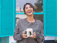 woman with cute coffee mug with cat design
