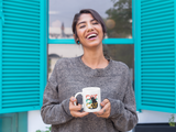 woman with cute coffee mug with cat design